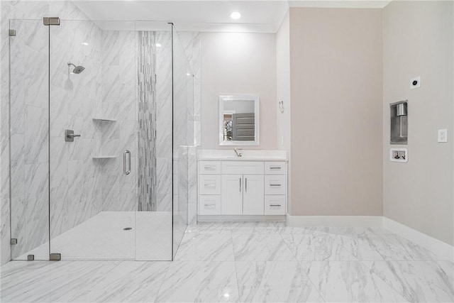 bathroom featuring marble finish floor, crown molding, vanity, and a marble finish shower