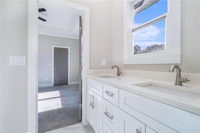 bathroom featuring a sink and baseboards