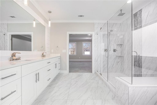 bathroom featuring marble finish floor, crown molding, a marble finish shower, visible vents, and a sink