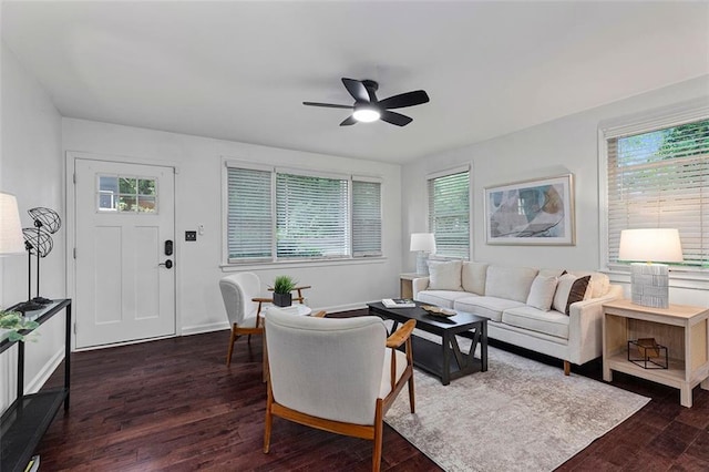 living room with a ceiling fan, baseboards, wood finished floors, and plenty of natural light
