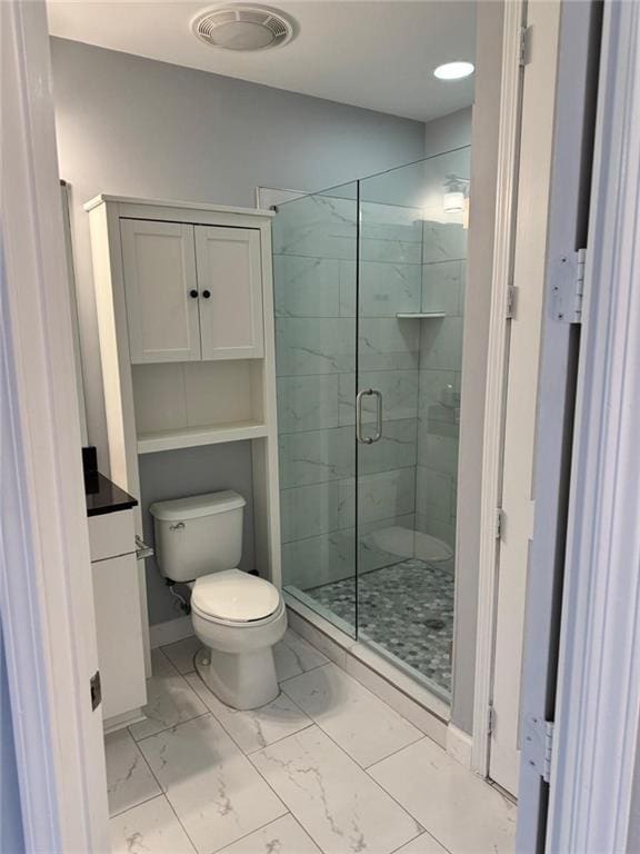 711 Cosmopolitan Dr NE Unit 426, Atlanta, GA 30324 - bathroom featuring toilet, marble finish floors, and a shower stall