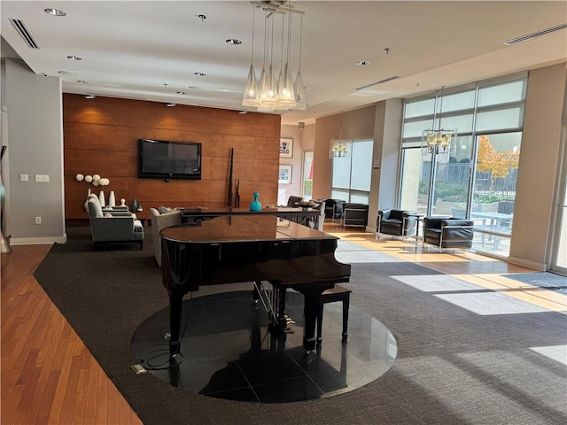 711 Cosmopolitan Dr NE Unit 426, Atlanta, GA 30324 - rec room featuring wood finished floors, recessed lighting, a wall of windows, and wood walls
