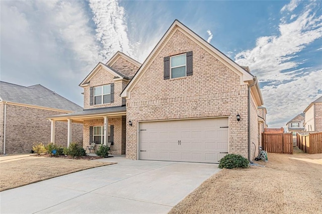 view of front of property featuring an attached garage, covered porch, brick siding, fence, and concrete driveway