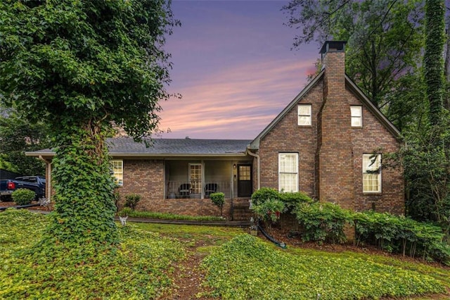 6230 S Summers Cir S, Douglasville, GA 30135 - view of front of property with a chimney, brick siding, and a front yard