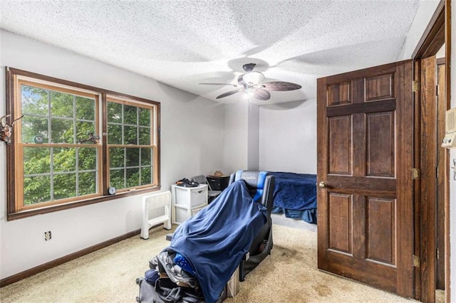 6230 S Summers Cir S, Douglasville, GA 30135 - bedroom featuring light colored carpet, a ceiling fan, a textured ceiling, and baseboards