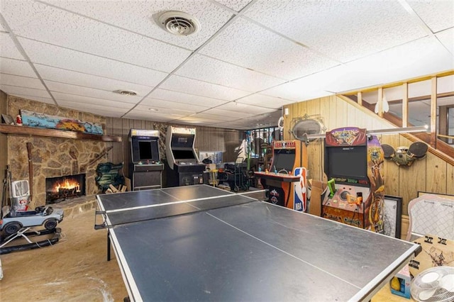 6230 S Summers Cir S, Douglasville, GA 30135 - playroom with a drop ceiling, a fireplace, wood walls, and concrete flooring