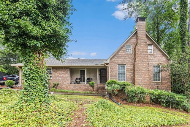 6230 S Summers Cir S, Douglasville, GA 30135 - view of front of house with a chimney, a front lawn, and brick siding