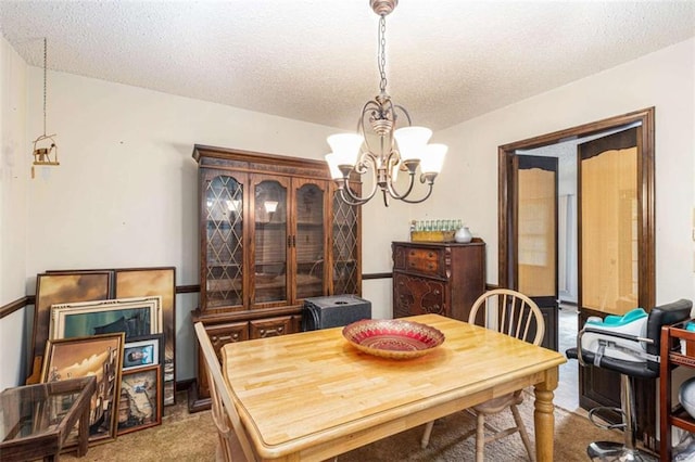 6230 S Summers Cir S, Douglasville, GA 30135 - carpeted dining space featuring a chandelier and a textured ceiling