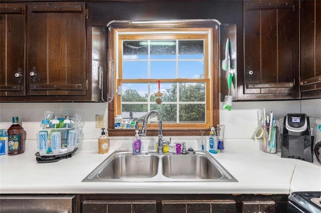 6230 S Summers Cir S, Douglasville, GA 30135 - kitchen featuring a sink, dark brown cabinets, light countertops, and stove