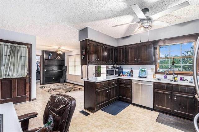 6230 S Summers Cir S, Douglasville, GA 30135 - kitchen featuring stainless steel appliances, a ceiling fan, a sink, light countertops, and dark brown cabinetry