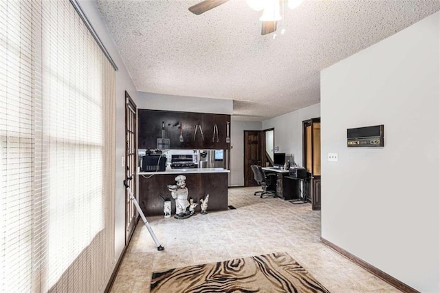 6230 S Summers Cir S, Douglasville, GA 30135 - kitchen with a desk, a textured ceiling, ceiling fan, and range