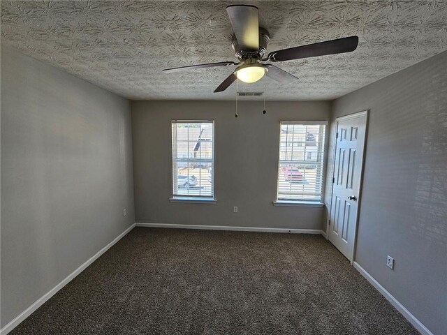 6500 Wellington Chase Ct, Lithonia, GA 30058 - empty room with carpet, visible vents, baseboards, ceiling fan, and a textured ceiling