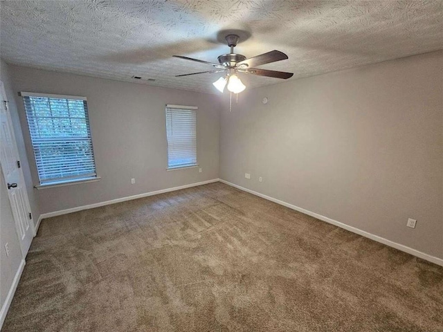 6500 Wellington Chase Ct, Lithonia, GA 30058 - unfurnished room with a textured ceiling, baseboards, carpet floors, and ceiling fan