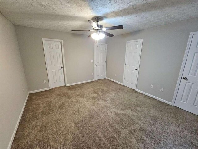 6500 Wellington Chase Ct, Lithonia, GA 30058 - unfurnished bedroom featuring baseboards, a textured ceiling, ceiling fan, and carpet flooring