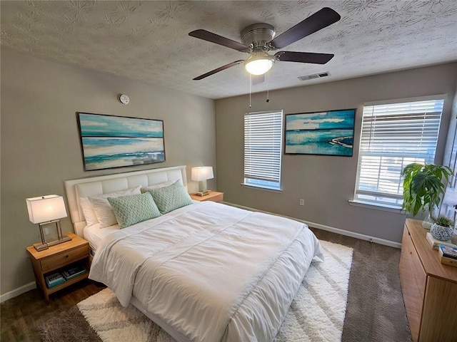 6500 Wellington Chase Ct, Lithonia, GA 30058 - bedroom with visible vents, baseboards, a textured ceiling, and ceiling fan