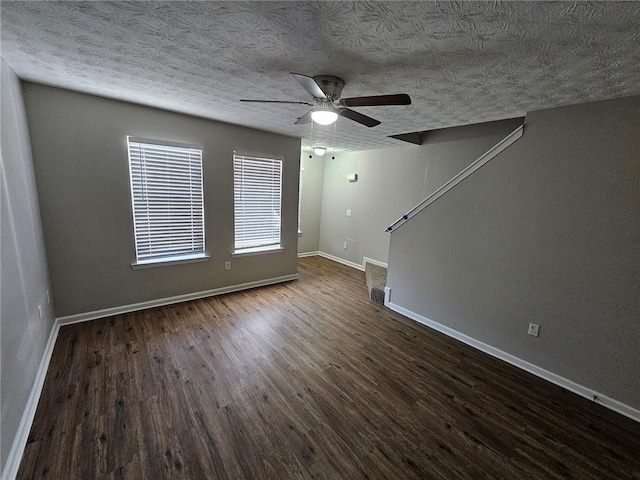 6500 Wellington Chase Ct, Lithonia, GA 30058 - unfurnished living room featuring a textured ceiling, wood finished floors, baseboards, and ceiling fan