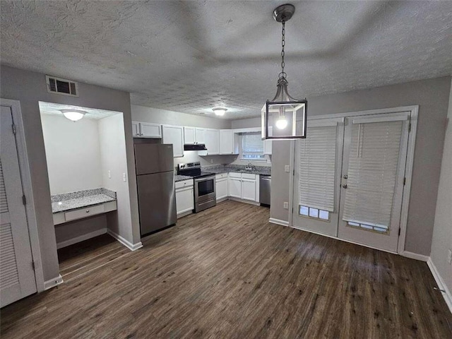 6500 Wellington Chase Ct, Lithonia, GA 30058 - kitchen featuring dark wood-style floors, visible vents, white cabinetry, and stainless steel appliances