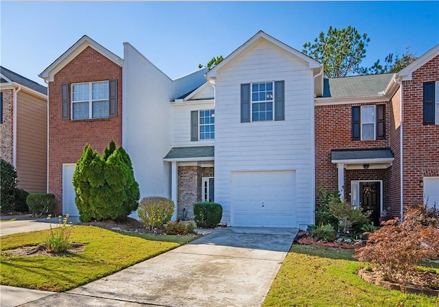 view of front of house featuring a front yard and a garage