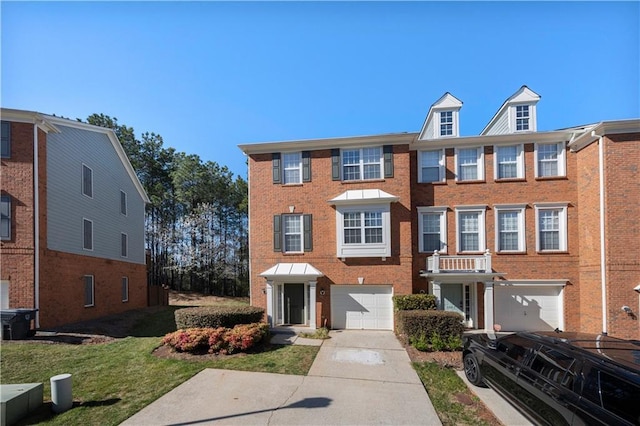 view of property with concrete driveway, brick siding, and an attached garage