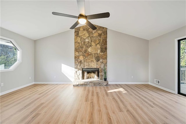 unfurnished living room with visible vents, baseboards, vaulted ceiling, light wood-style floors, and a ceiling fan