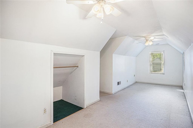 bonus room with ceiling fan, light colored carpet, and lofted ceiling