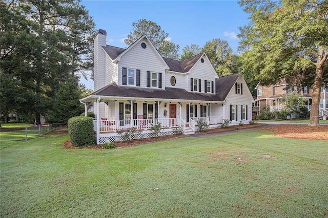 country-style home with a porch and a front lawn