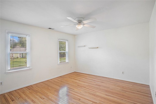 unfurnished room with ceiling fan and light hardwood / wood-style floors