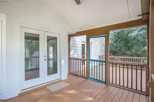 unfurnished sunroom with french doors and vaulted ceiling