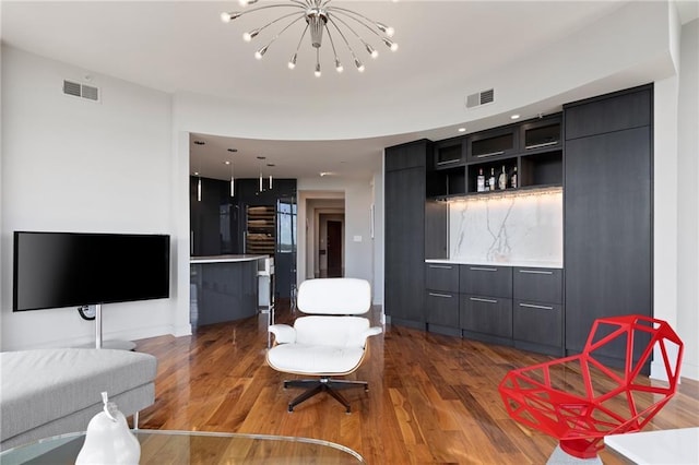 kitchen with modern cabinets, wood finished floors, light countertops, open shelves, and recessed lighting