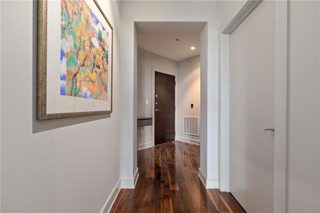 bedroom featuring baseboards, wood finished floors, and ceiling fan