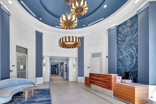 hall featuring light tile patterned flooring, baseboards, and recessed lighting
