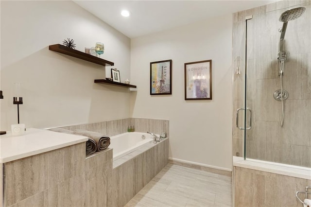 bathroom with plus walk in shower and tile patterned flooring