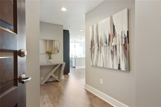 hallway with wood-type flooring