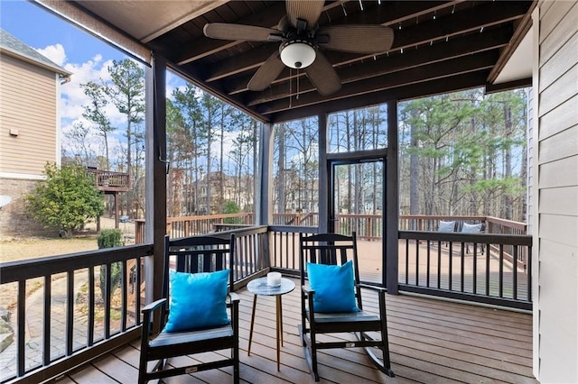 sunroom with a ceiling fan