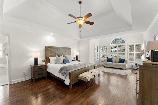 bedroom featuring baseboards, a raised ceiling, ceiling fan, wood-type flooring, and recessed lighting