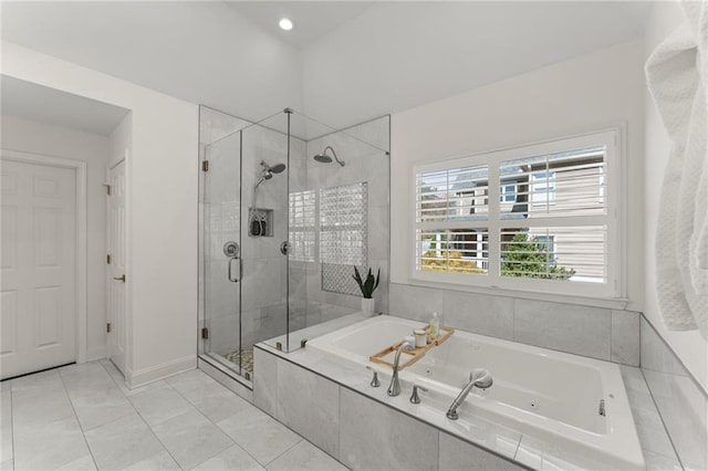 full bath featuring a whirlpool tub, a shower stall, baseboards, and tile patterned flooring