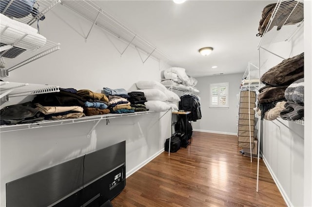 spacious closet with wood finished floors