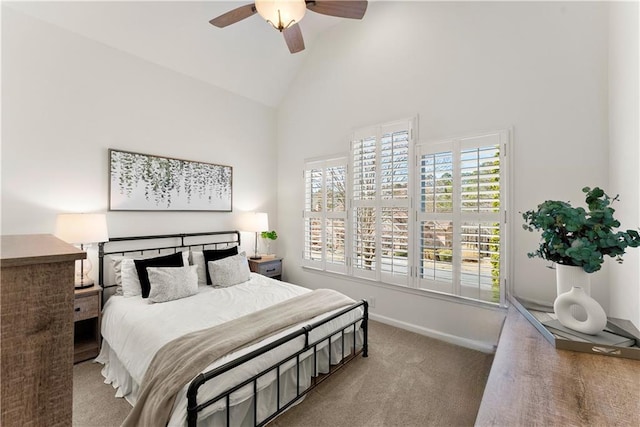 bedroom with carpet, high vaulted ceiling, ceiling fan, and baseboards