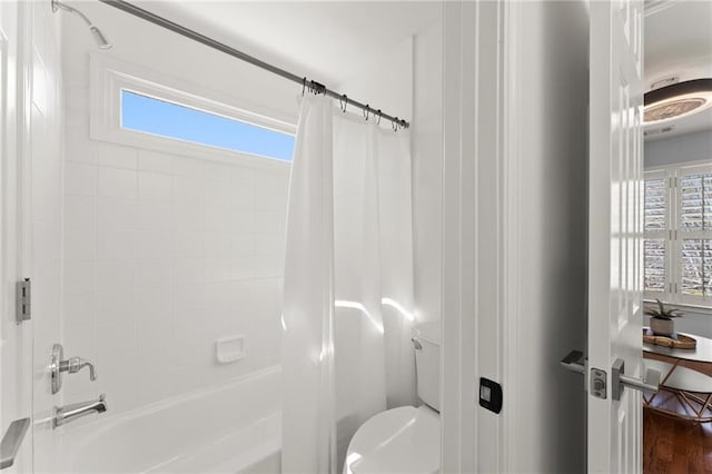 full bath featuring shower / bathtub combination with curtain and toilet