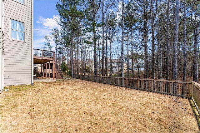 view of yard with stairs and a wooden deck