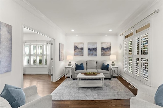 living area with baseboards, visible vents, dark wood-type flooring, crown molding, and recessed lighting