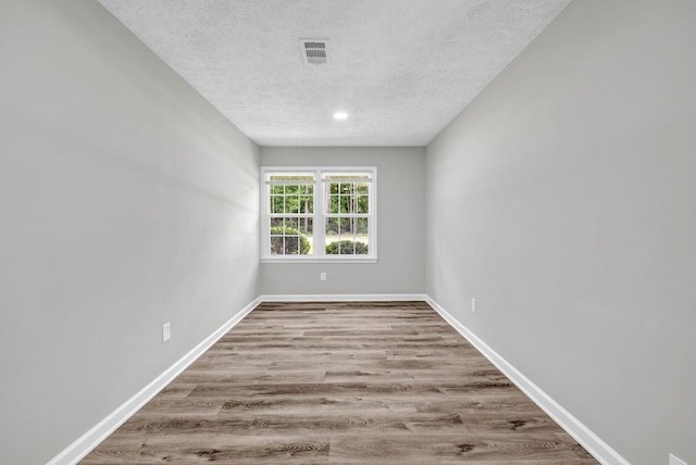 2089 Christian Cir SE, Conyers, GA 30013 - unfurnished room featuring a textured ceiling and wood finished floors