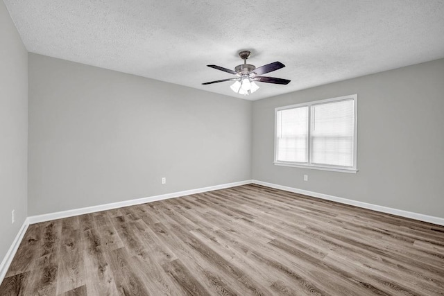 2089 Christian Cir SE, Conyers, GA 30013 - empty room with a textured ceiling, wood finished floors, and ceiling fan