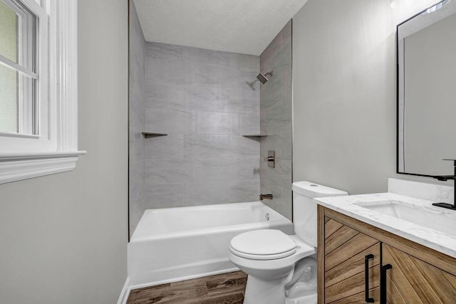 2089 Christian Cir SE, Conyers, GA 30013 - full bath featuring wood finished floors, vanity, tub / shower combination, and a textured ceiling