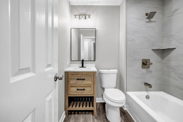 2089 Christian Cir SE, Conyers, GA 30013 - full bath featuring wood finished floors, vanity, and  shower combination