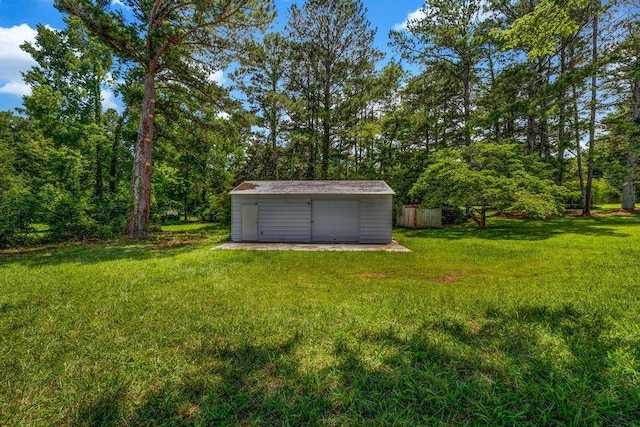 2089 Christian Cir SE, Conyers, GA 30013 - view of green lawn with a storage unit and a detached garage