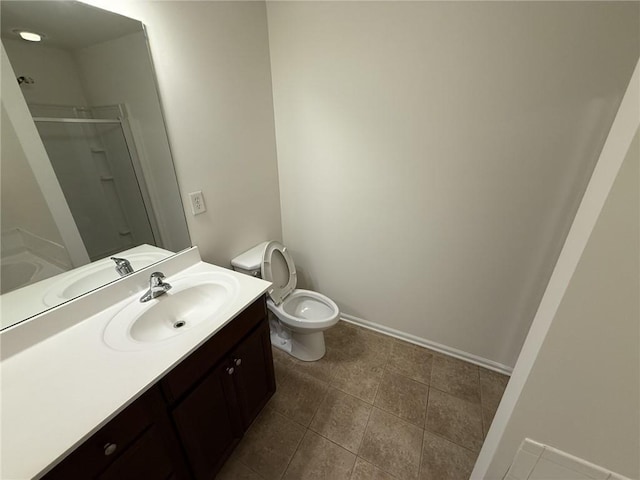 full bathroom featuring tile patterned floors, toilet, a stall shower, baseboards, and vanity