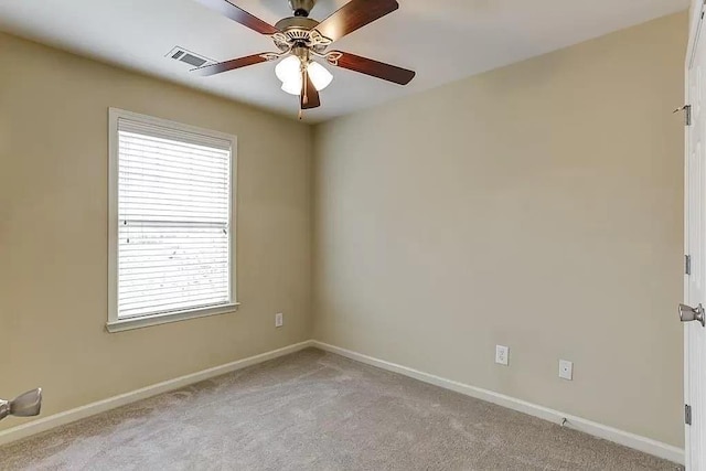 unfurnished room featuring ceiling fan and light colored carpet