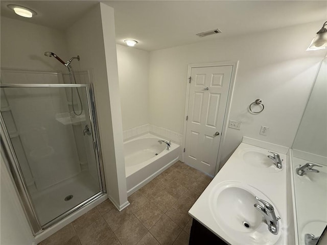 full bath with a sink, visible vents, and a shower stall