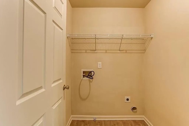 laundry room with washer hookup, hookup for an electric dryer, and wood-type flooring